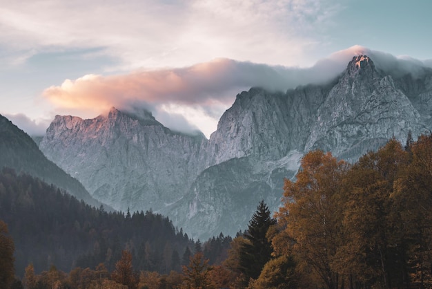 Triglav mountain peak at sunrise with beautiful clouds in morning light. Slovenia, Triglav National Park