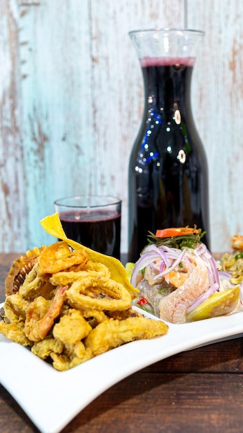 Trio seafood, chicharrón, ceviche and mixed rice.