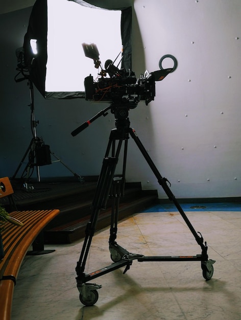 Photo tripod on floor in studio