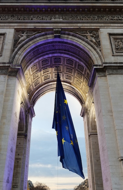 The Triumphal Arch decorated with European flag Paris France