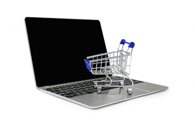 A trolley on a laptop keyboard on white  background with clipping path