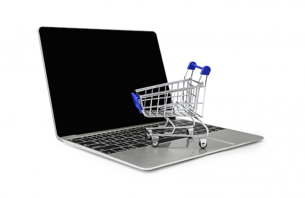 a trolley on a laptop keyboard on white  background with clipping path