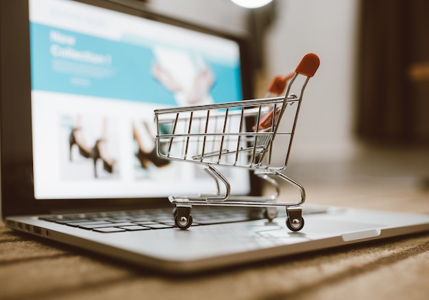 Trolley shopping cart on a laptop