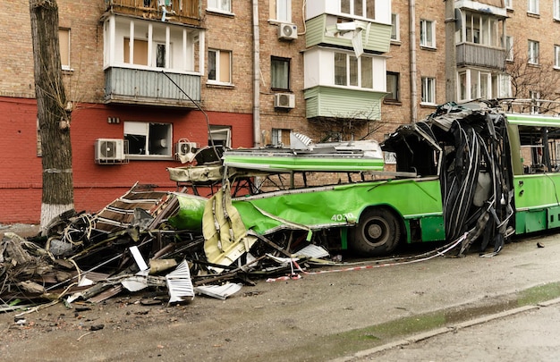 The trolleybus was destroyed on the street after Russian shelling consequences of the war in Ukraine broken transport