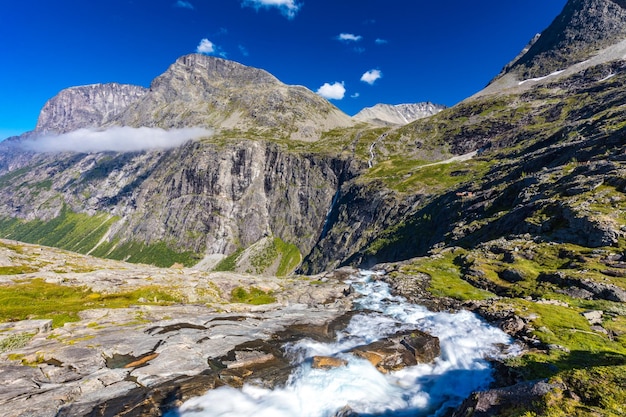 Trollstigen or trolls path is a serpentine mountain road in rauma municipality in norway