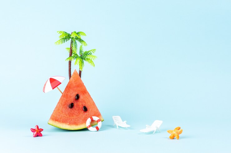 Tropical beach concept made with watermelon and sun umbrella