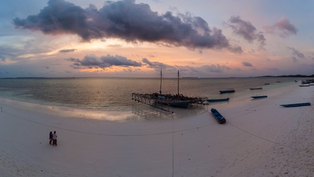 Photo tropical beach island dramatic sky at sunset sunrise