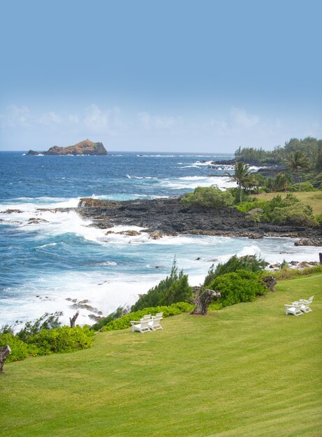 Tropical beach scene. Sea view from summer beach with sky. Coastal landscape.