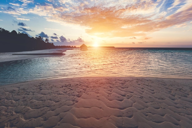 Tropical beach during sunset on an island