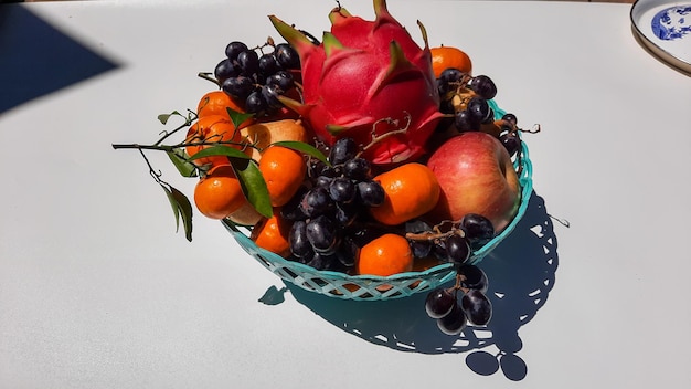 Tropical dragon fruit Orange, pear, grape isolated on white background and shadow ornament