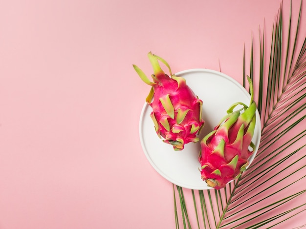 Tropical flat lay with palm leaves and coconut 