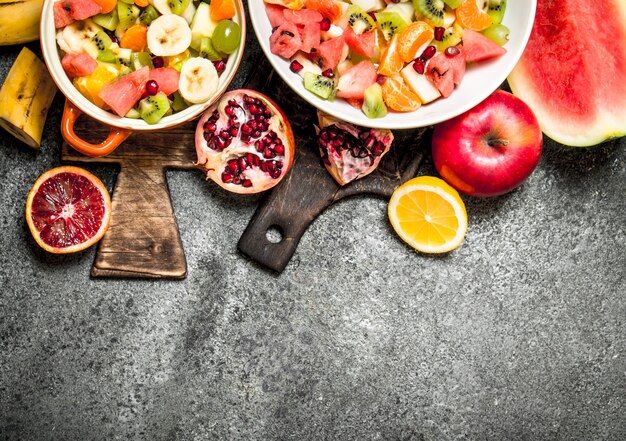 Tropical food . A tropical fruit salad. On rustic background.