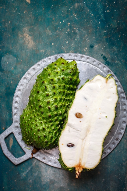 Tropical fruit of guanabana on a concrete table