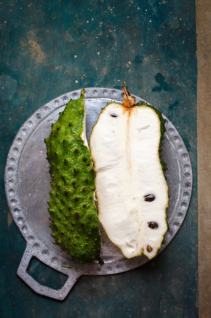 Tropical fruit of guanabana on a concrete table