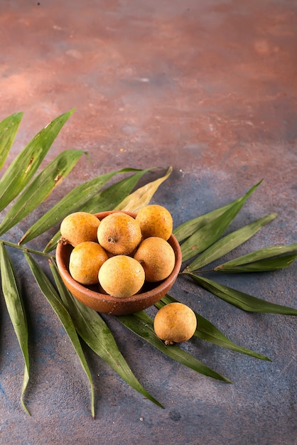 Tropical fruit longan in the bamboo basket 