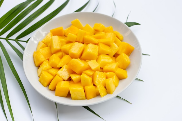 Tropical fruit, mango cube slices in white bowl