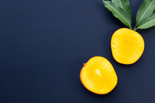 Tropical fruit, Mango  on dark wall.