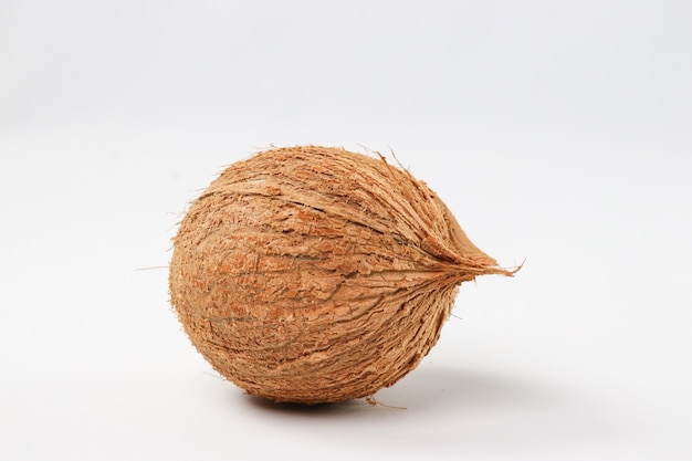 tropical fruit whole coconut on white