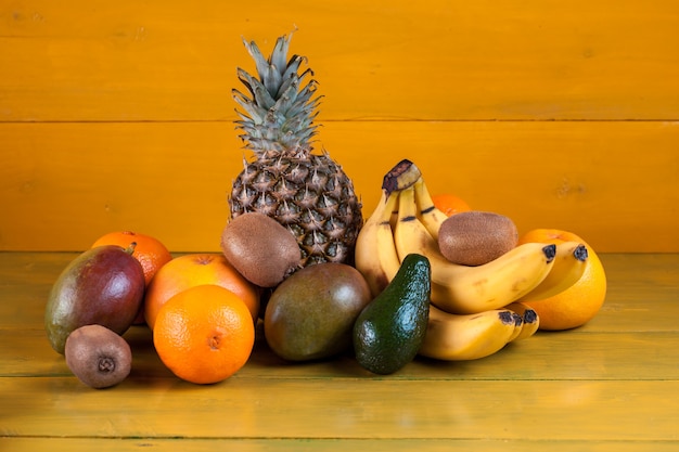 Tropical fruit on yellow wooden, fresh food