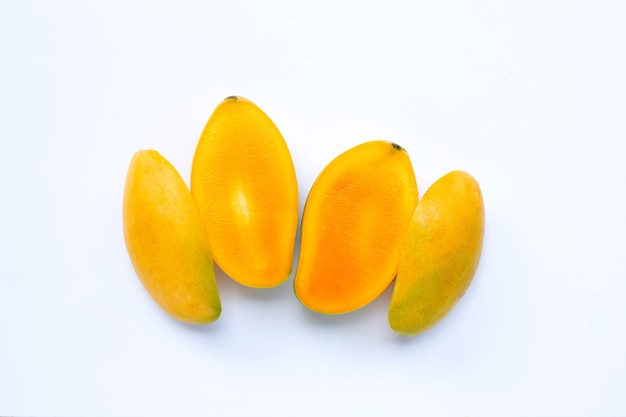 Tropical fruits on white surface