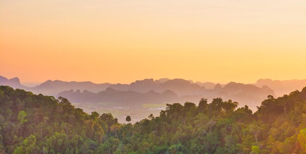 Tropical landscape with steep mountains at sunset