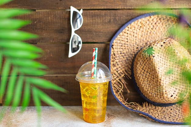 tropical leaf palm lemonade refreshing cold ice drink straw hat sunglasses relax accessories