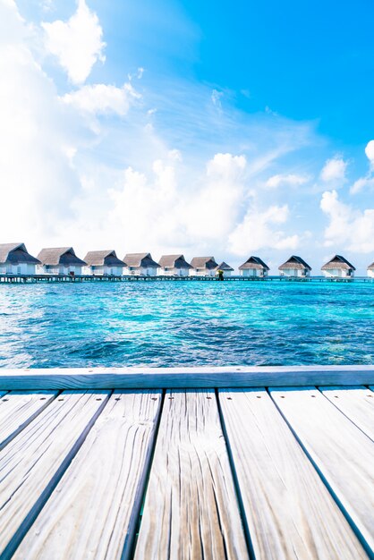 Photo tropical maldives resort hotel and island with beach and sea for holiday vacation concept