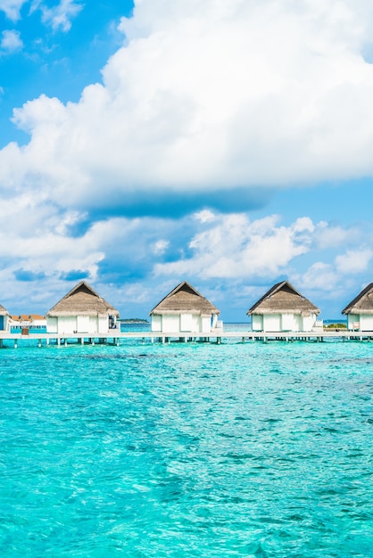 tropical Maldives resort hotel and island with beach and sea for holiday vacation concept