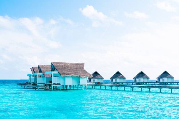 tropical Maldives resort hotel and island with beach and sea for holiday vacation concept