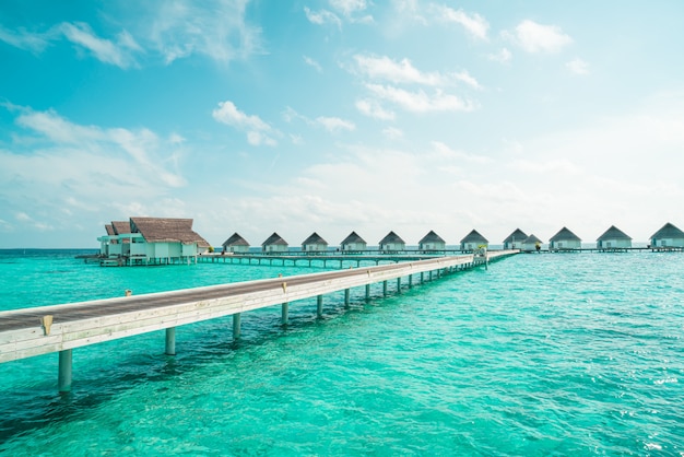 tropical Maldives resort hotel and island with beach and sea for holiday vacation concept