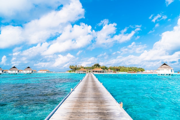 tropical Maldives resort hotel and island with beach and sea 