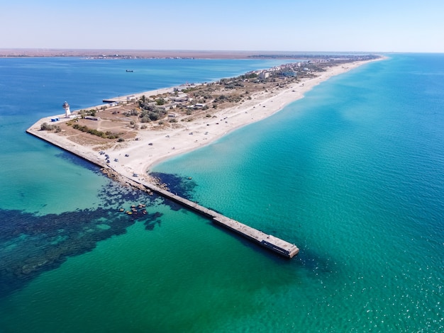 Tropical sandy beach dividing an exotic turquoise sea and lake sand bar in the sea