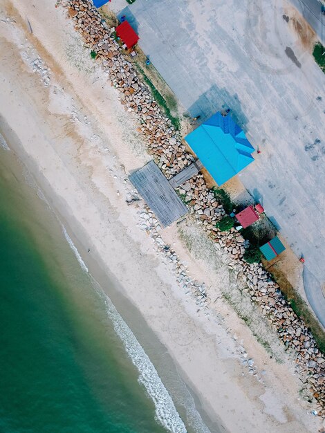 Tropical sandy beach with colorful houses photo