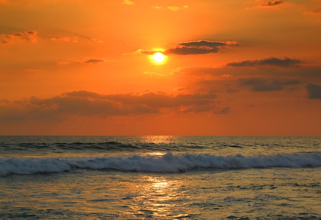 Tropical sea sunset and waves