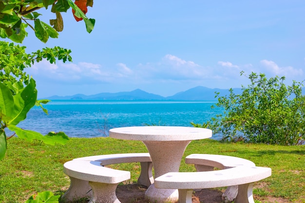 Tropical seashore with a table on a picturesque beach on a sunny day Rest and relaxation