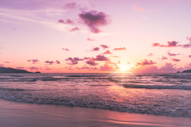 Tropical summer beach sand and beautiful sky with coconut palm tree background