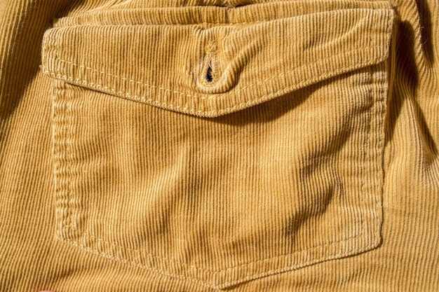 Trouser pocket closeup Corduroy yellow texture