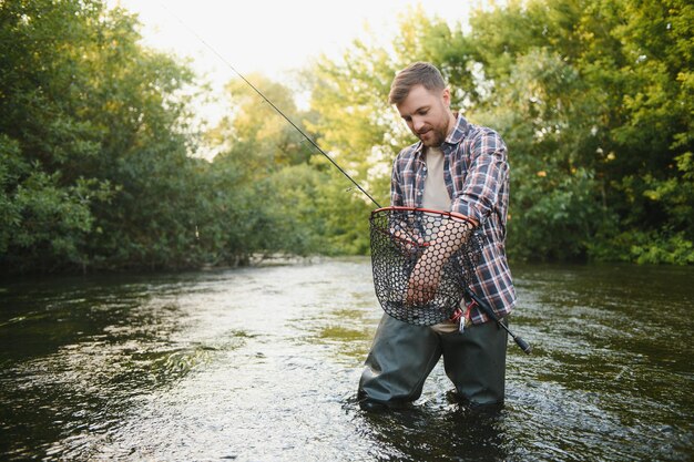 Trout being caught in fishing net