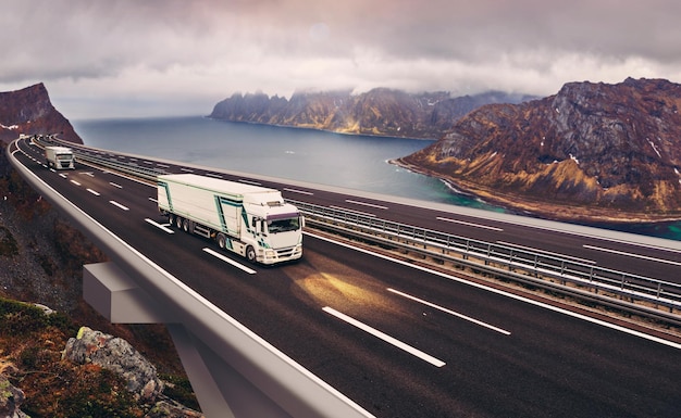 Photo truck on bridge over sea against cloudy sky