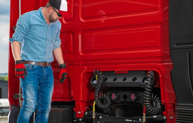 Photo truck driver getting ready for a trailer hook up