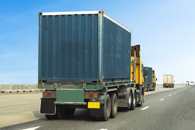 Truck on highway road with blue container