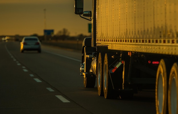 Photo truck on highway in sunset light