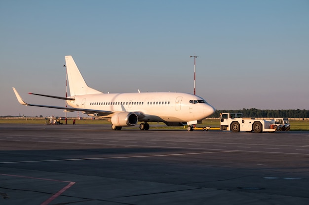 The truck is towing the passenger aircraft