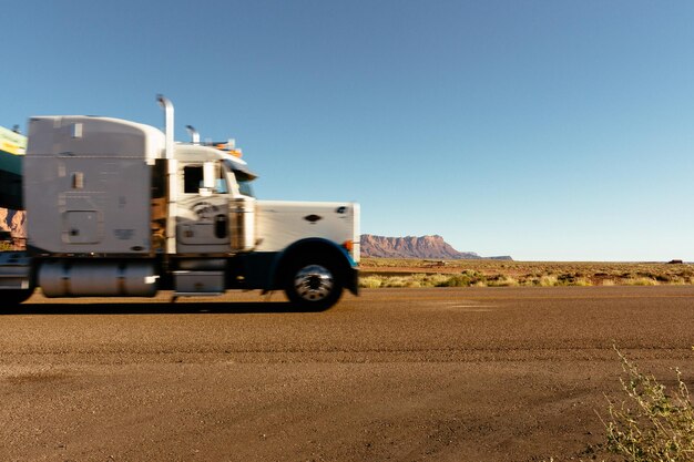 Truck on road against clear sky