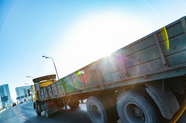 Truck on road at sunrise