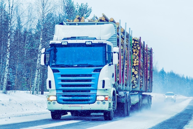 Truck at the Snow Road at winter Finland in Lapland.