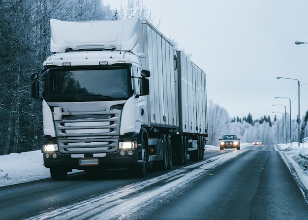 Truck at the Snowy winter Road in Finland of Lapland.