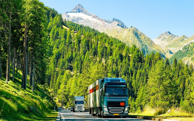 Truck in summer road of Switzerland. Trucker in highway. Lorry doing logistics work. Semi trailer with driver. Big cargo car drive. Freight delivery. Transport export industry. Container with goods