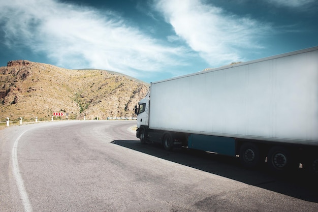 Truck with container on road cargo transportation concept