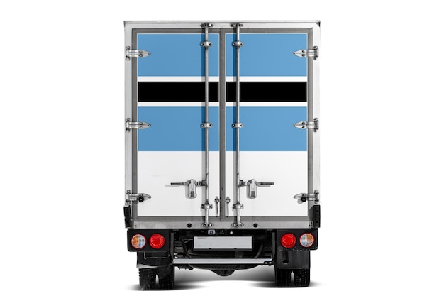 A truck with the national flag of Botswana depicted on the tailgate drives against a white background Concept of exportimport transportation national delivery of goods